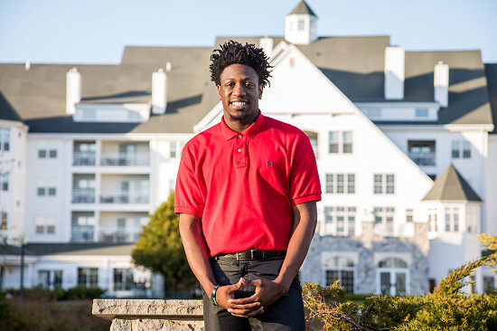 Lakeland University student poses at The Osthoff Resort in Elkhart Lake.